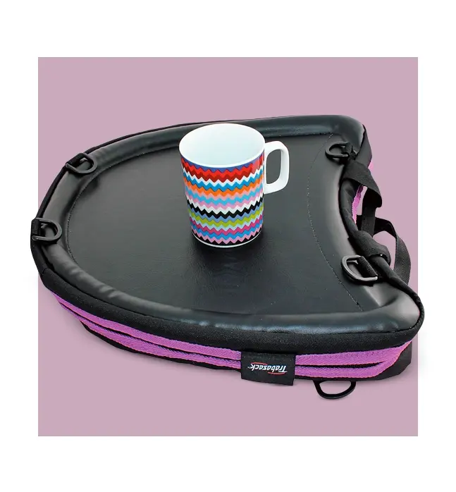 A Trabasack lap tray with a colorful mug on its non-slip surface, providing a stable and portable desk for travel