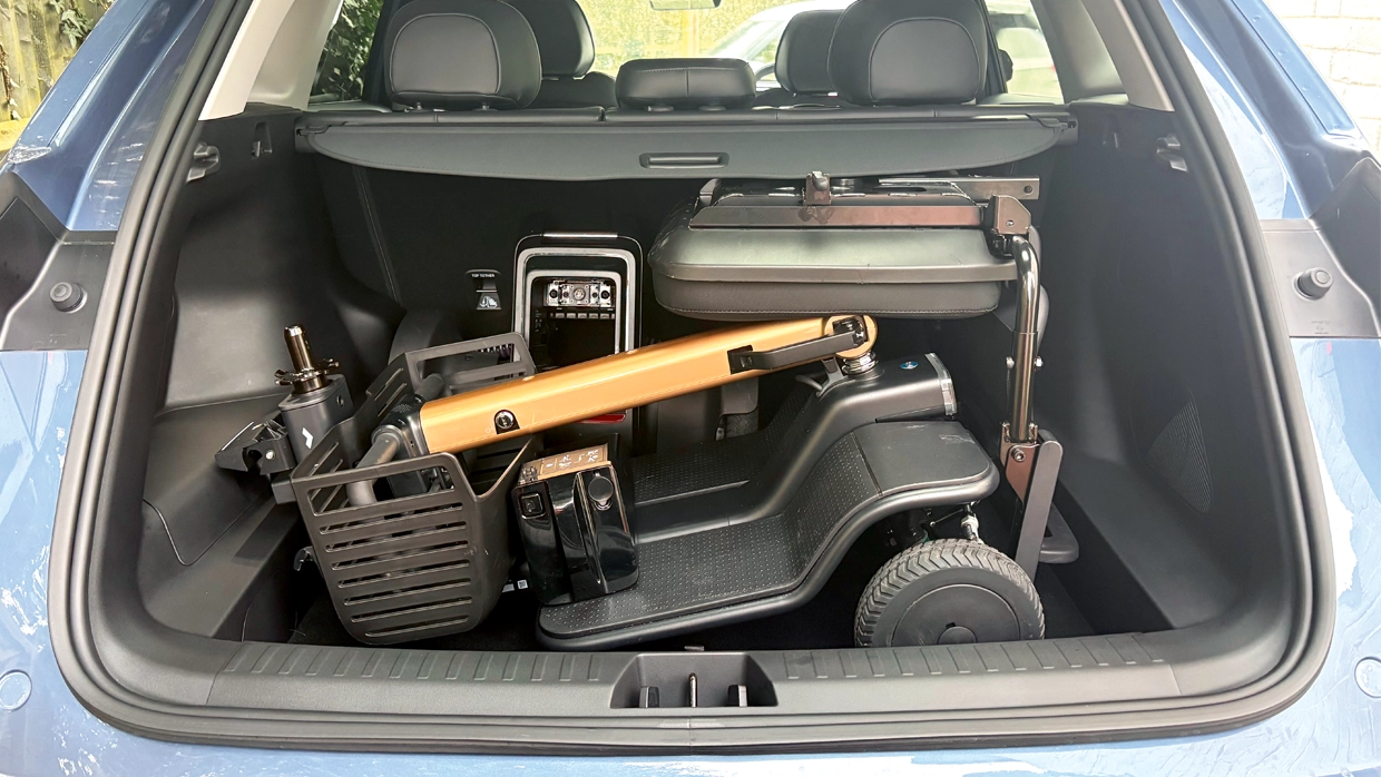 folded-mobility-scooter-stored-in-the-boot-of-a-blue-geely-starray-suv-with-the-rear-seats-in-an-upright-position.webp