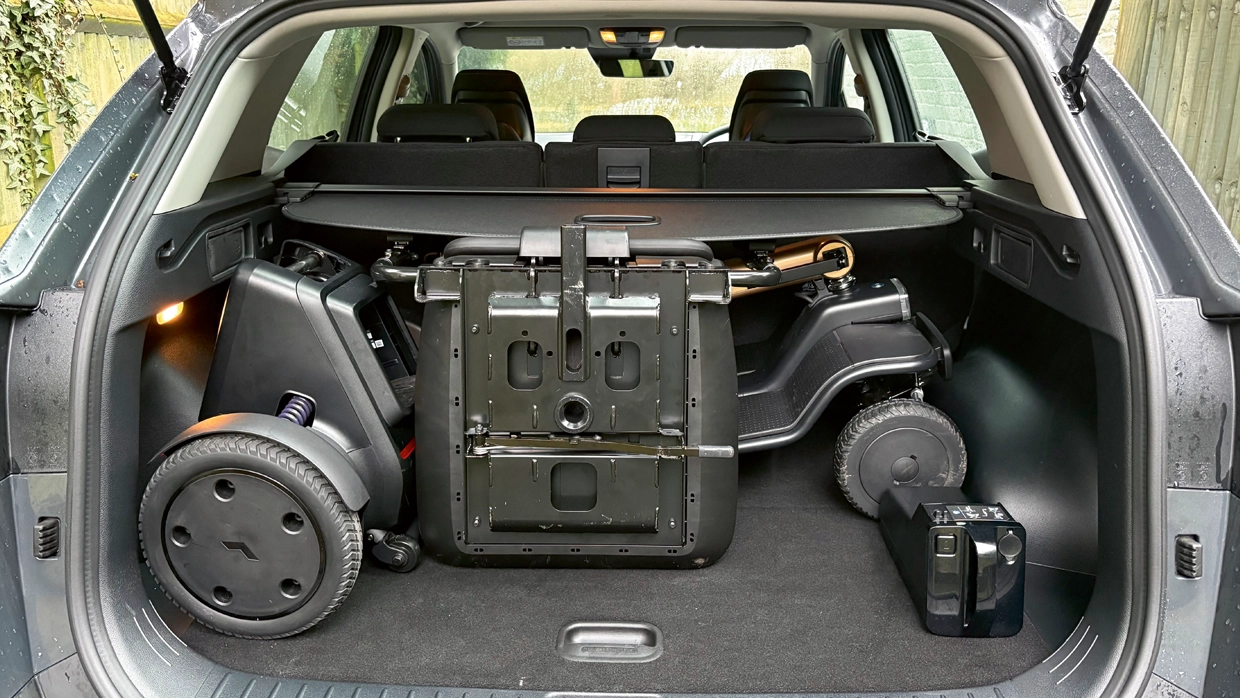 folded-mobility-scooter-stored-in-the-boot-of-a-grey-kia-sportage-with-the-rear-seats-in-an-upright-position.webp