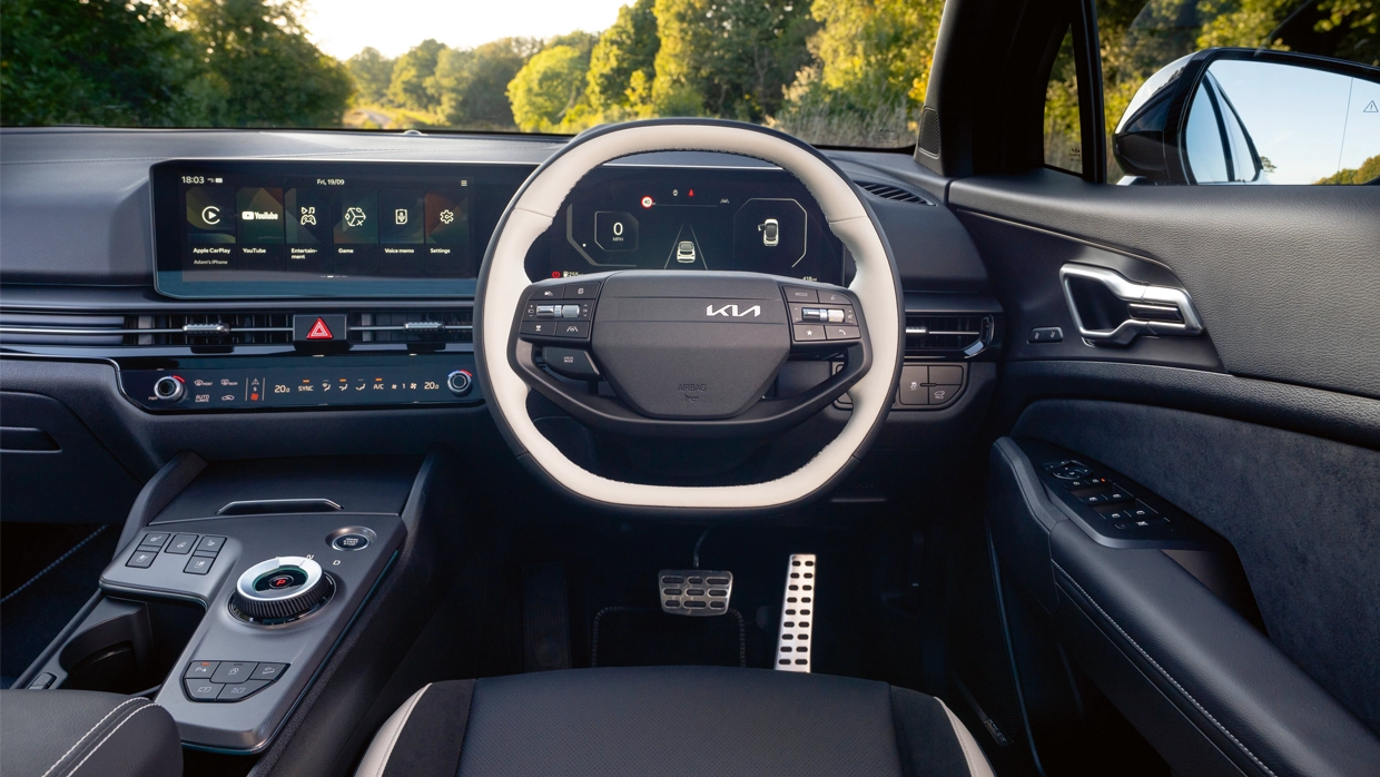 interior-of-a-kia-sportage-featuring-a-dual-screen-digital-cockpit-rotary-gear-selector-and-two-tone-steering-wheel.webp