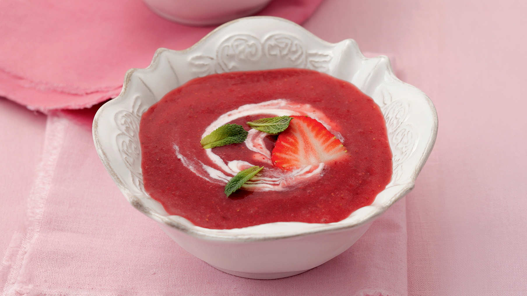 Strawberry soup in a white bowl 