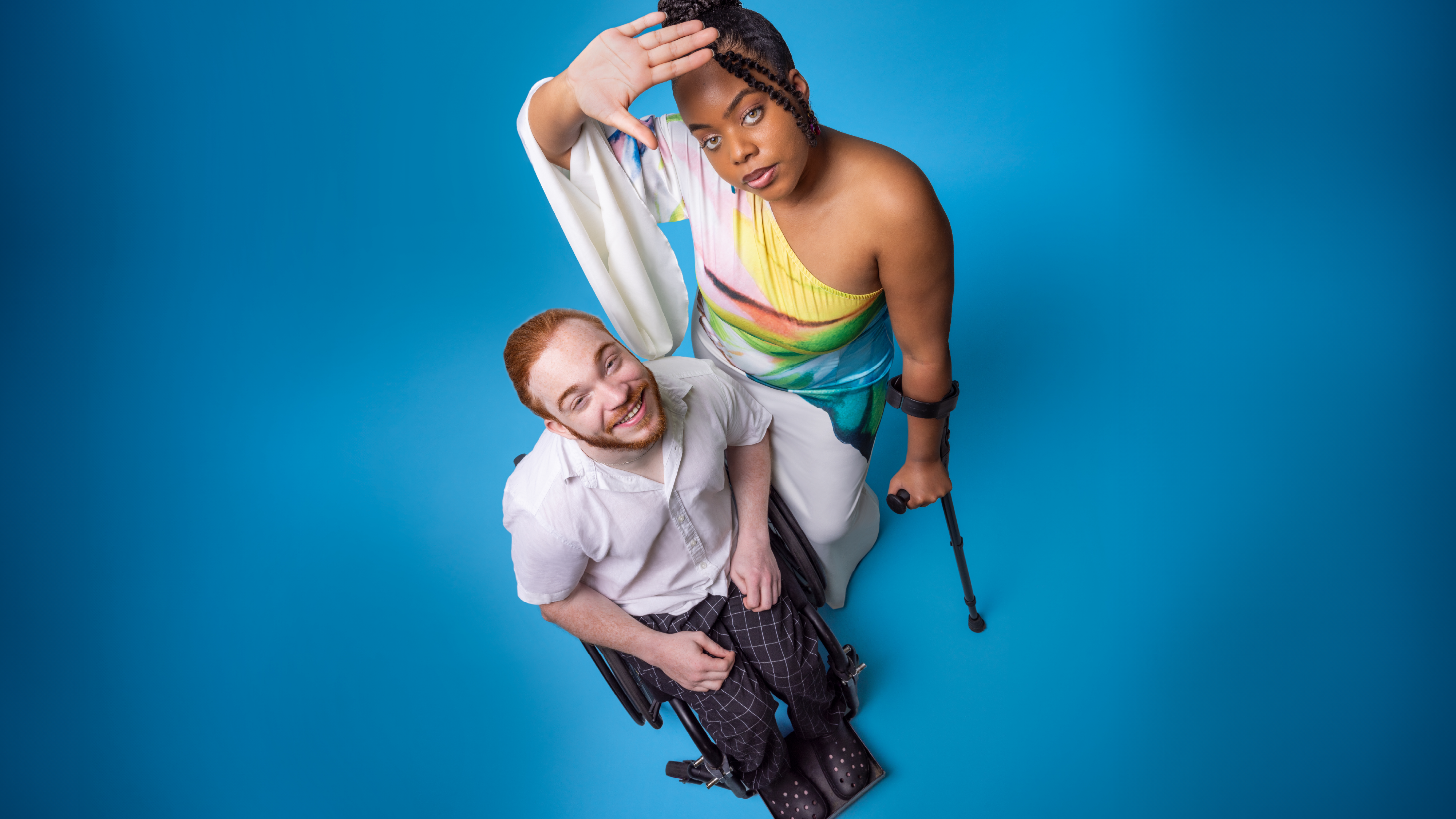 Charlie Randell and Caprice-Kwai Randell photographed in front of a blue backdrop