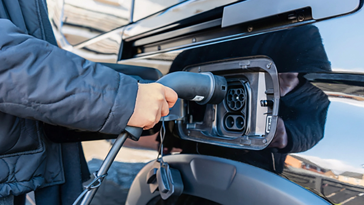 A charging cable being plugged into an electric WAV's charge point