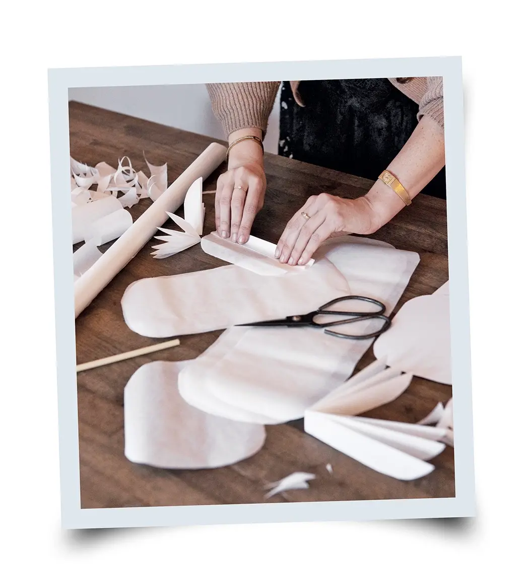 photo of a women folding the paper
