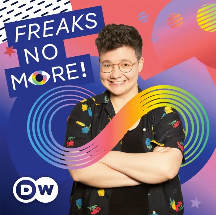 Promotional graphic for DW’s 'Freaks No More!' featuring a smiling person behind a rainbow neurodiversity infinity symbol