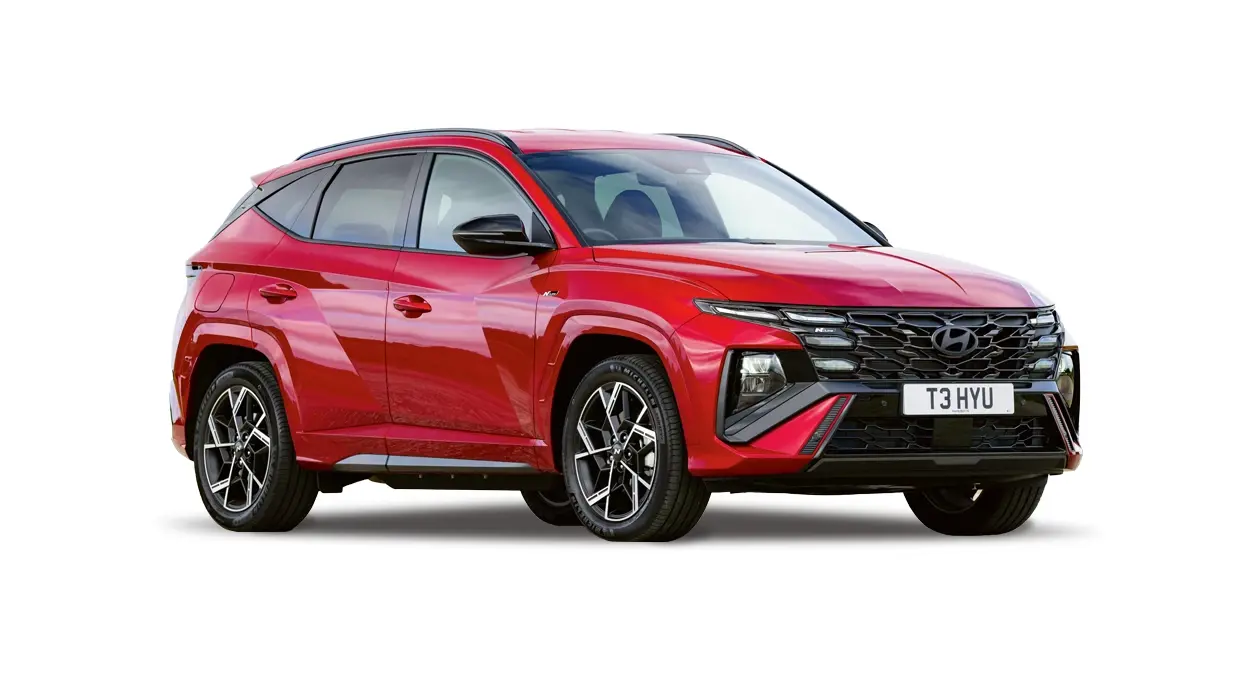A red Hyundai Tucson N-Line SUV with a distinctive black grille and alloy wheels, isolated on a white background
