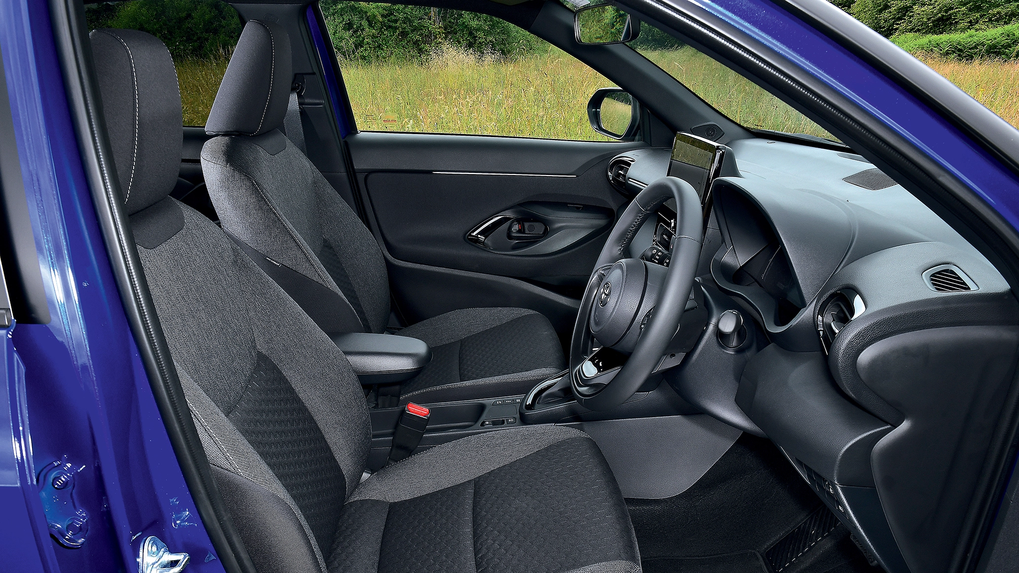 side-view-of-the-front-interior-of-a-toyota-yaris-cross.webp